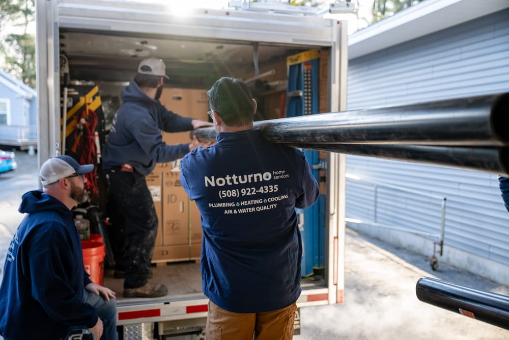 Notturno staff loading home materials into a truck.