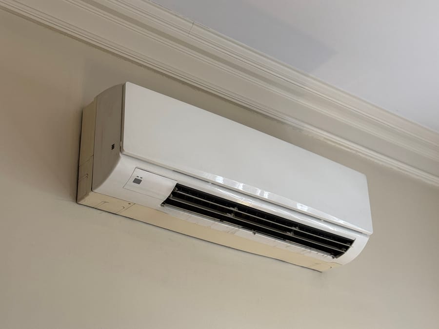 Ductless mini-split AC unit on wall