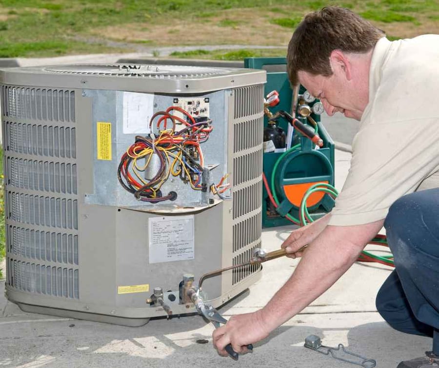 Technician working on an air conditioner