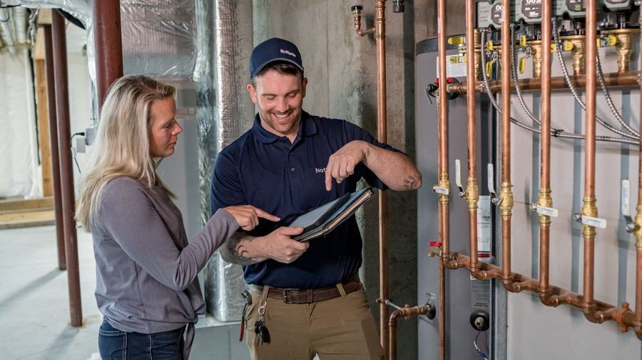 Nottruno tech telling a homeowner about their new copper piping