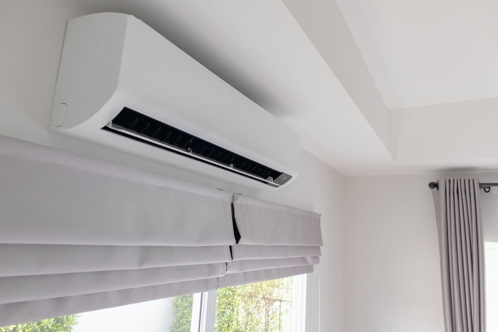 Ductless mini spit system mounted on a wall in a home