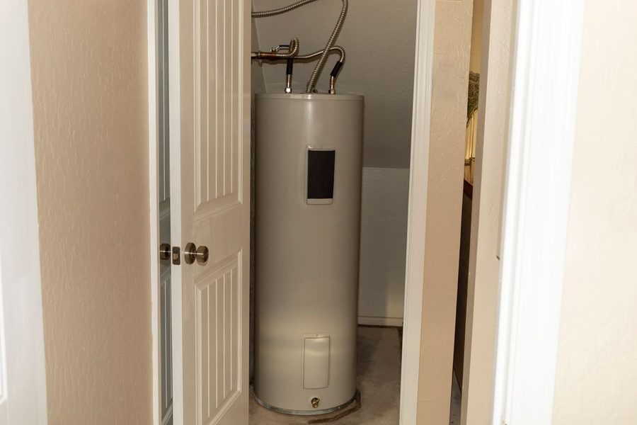 Water heater in a utility closet in a home