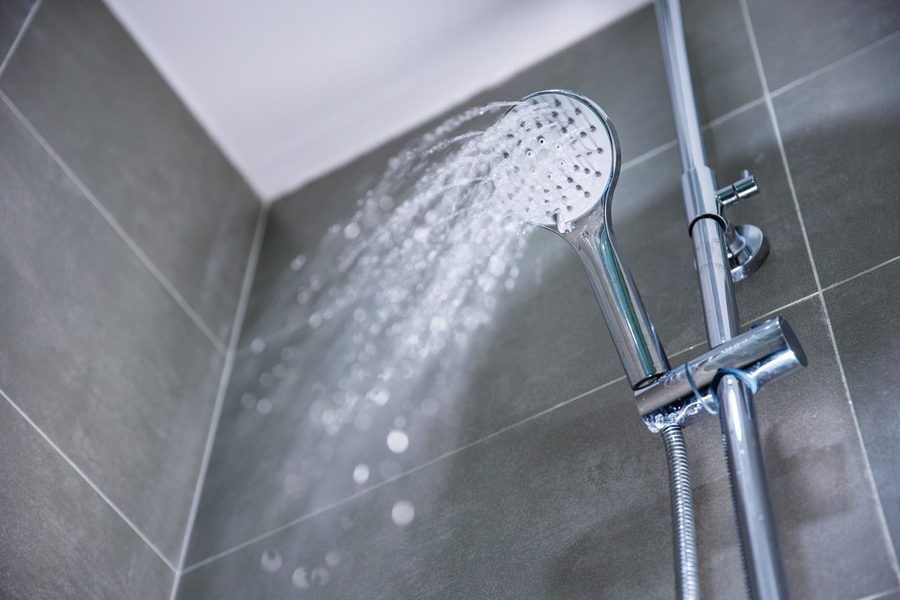 Stainless steel showerhead with water flowing from it